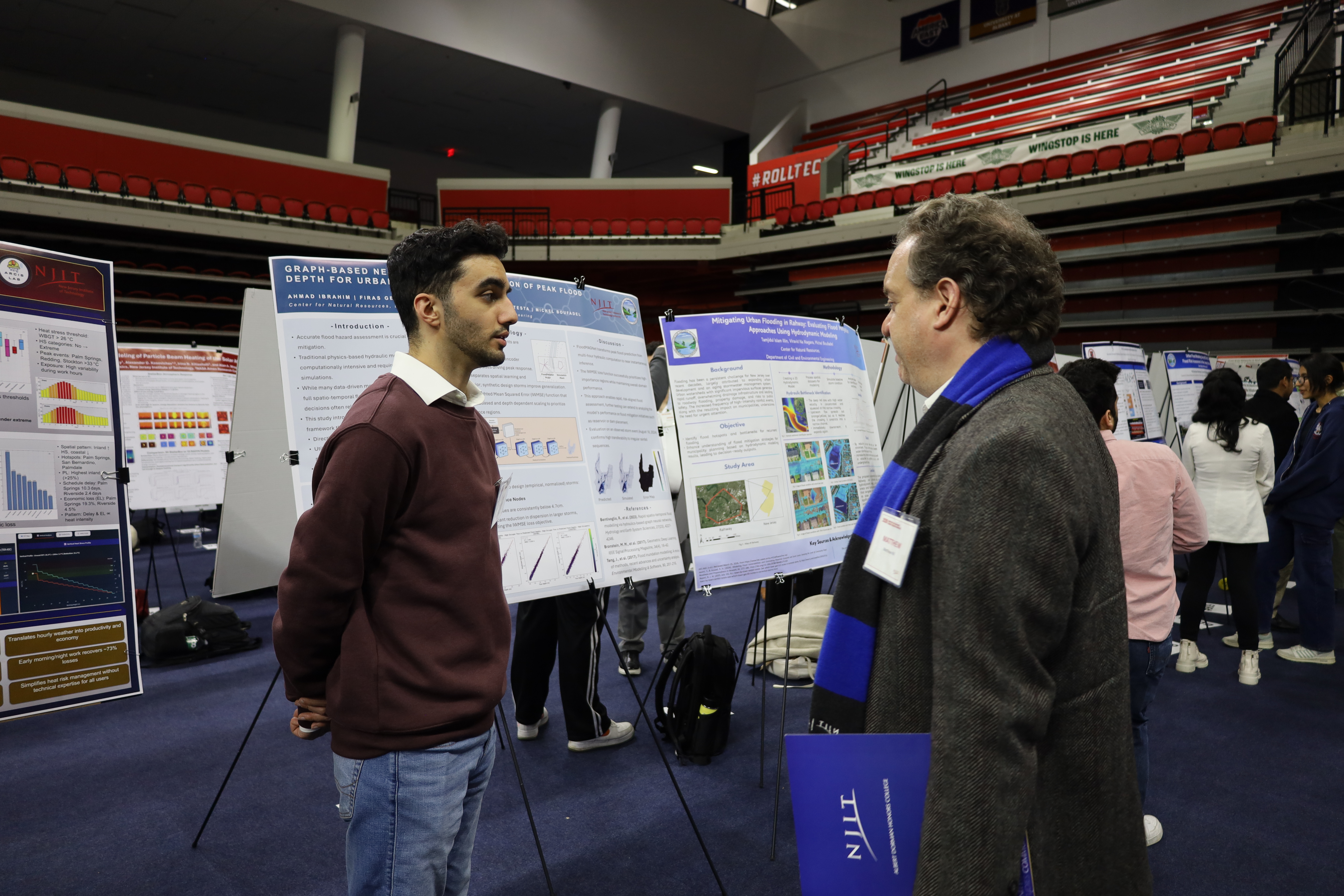 CNR student discussing research with attendee