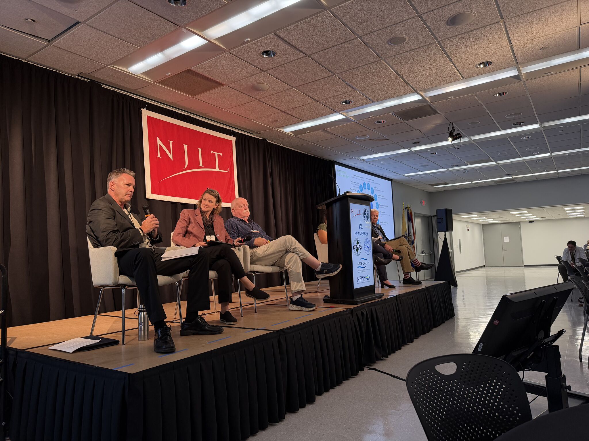 Student on stage speaking at an NJIT Campus