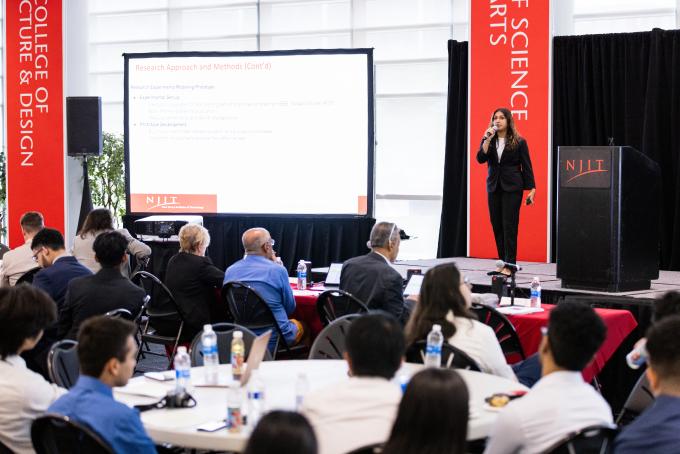 Student on stage speaking at an NJIT Campus
