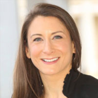 woman with brown hair smiling