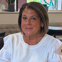 woman with white shirt and brown hair