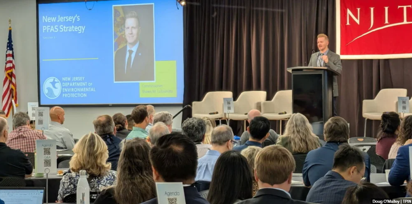 man in suit and tie speaks at NJIT event in Newark, New Jersey