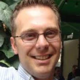 man with short hair and wearing eyeglasses
