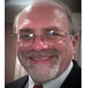 man with eyeglass and suit