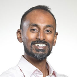 man with a beard and smiling
