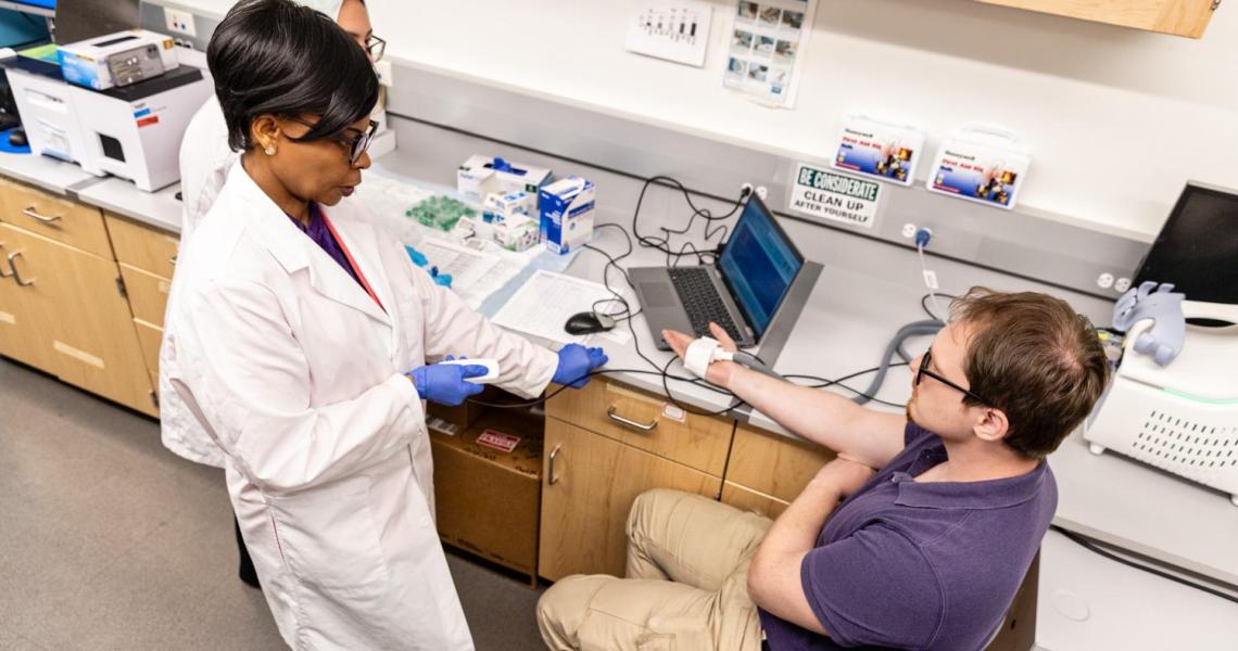 Photo of Dr Wunmi Sadik at work in the lab